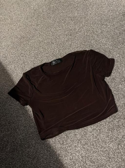  — Brown top