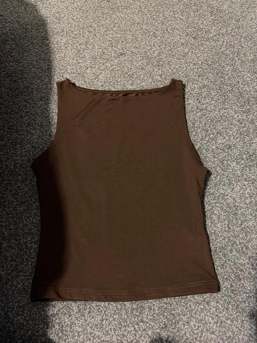  — Brown vest