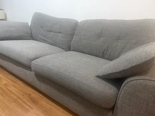  — Grey fabric four seater sofa