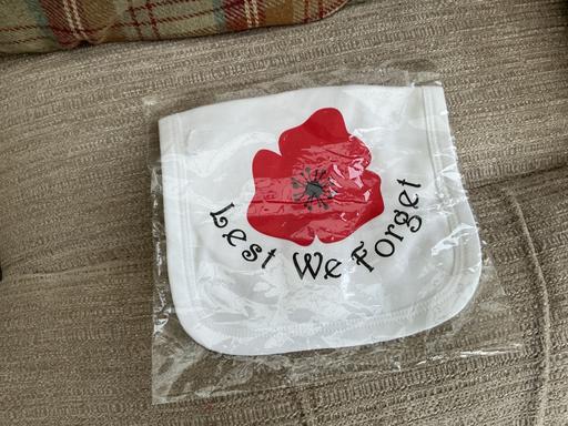  — Baby’s Poppy Day bib BN
