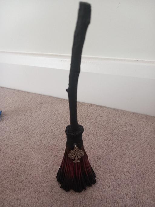  — broomstick statue