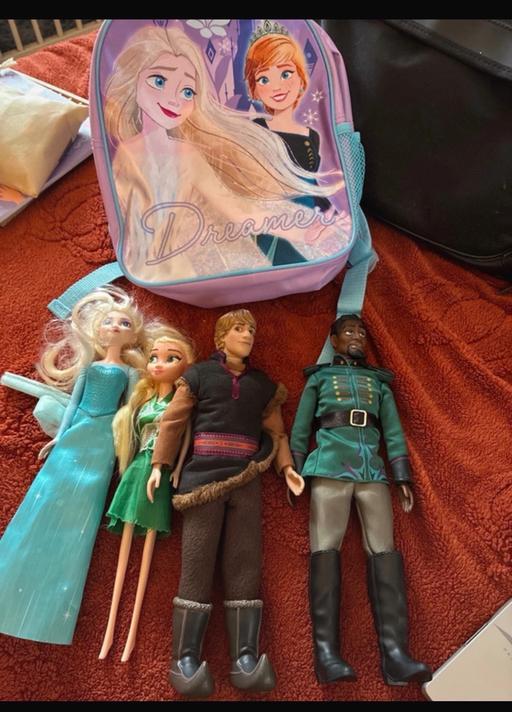  — Frozen dolls and backpack
