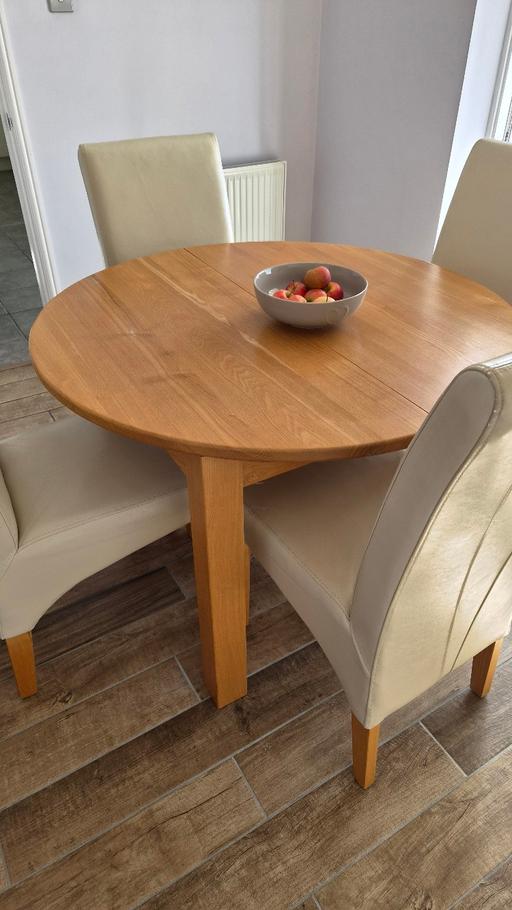  — Extendable Dining room table and 4 chairs