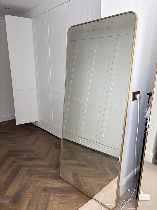  — Large gold rimmed mirror
