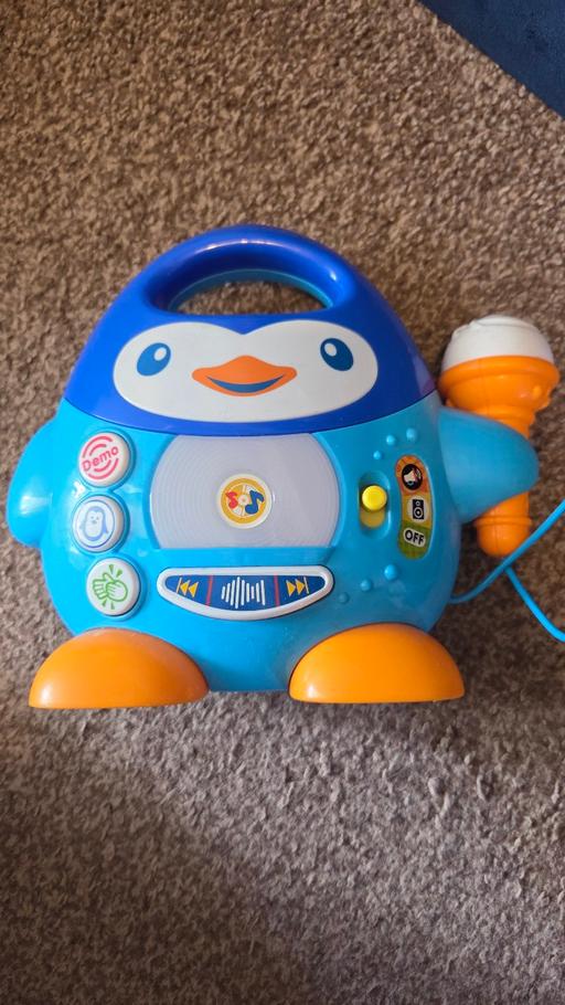  — singing  penguin microphone