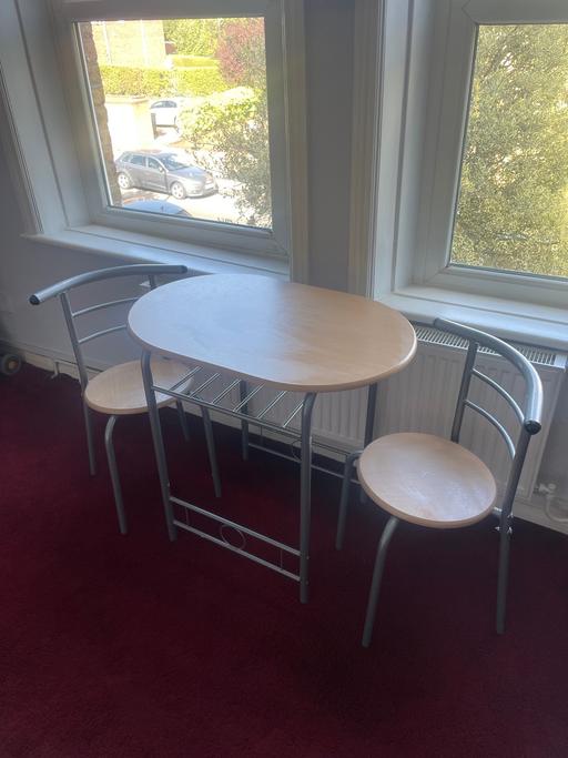  — Dining table and chairs