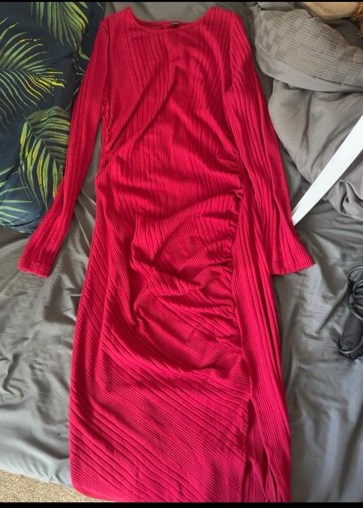  — Long red dress.