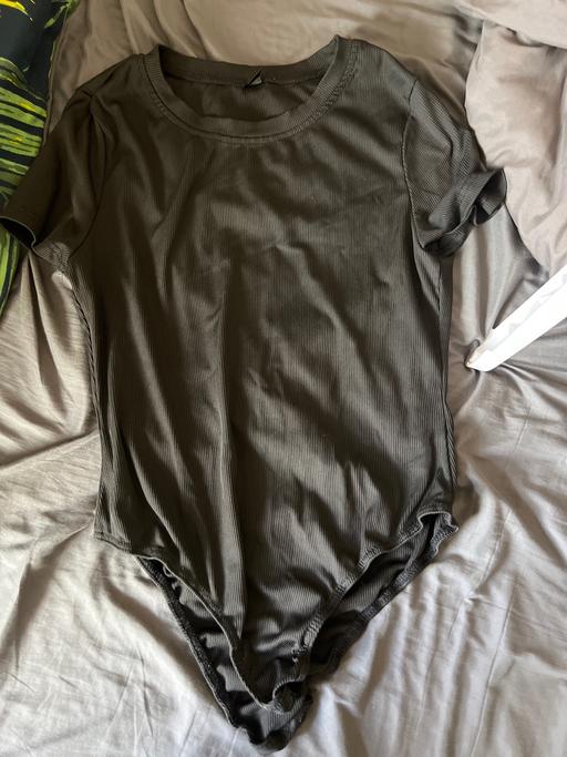 — Black body suit