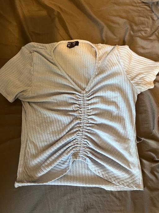  — Light blue scrunched top