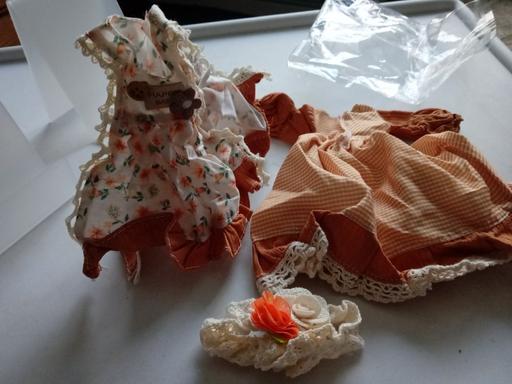  — new pack of PORCELAIN DOLL CLOTHES