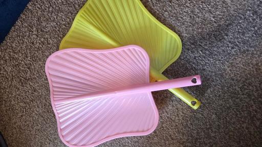  — 2x plastic hand fans