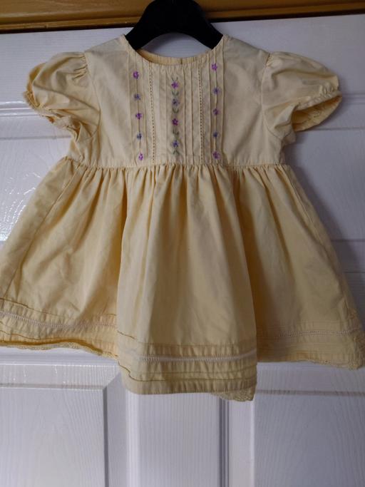  — Baby girls yellow dress size 3-6 months