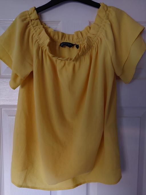  — Women's yellow top size 14