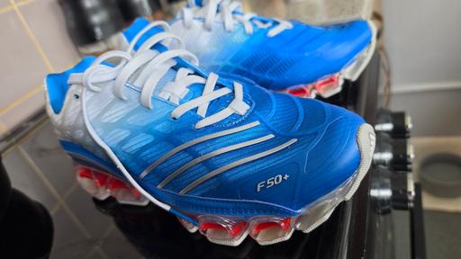 — Adidas Megaride F50+ trainers