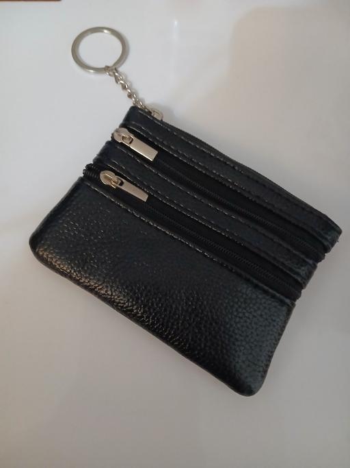  — Purse New