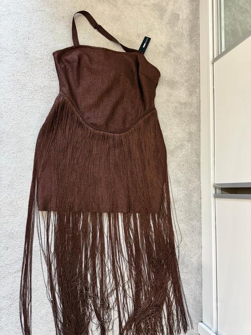  — Dress