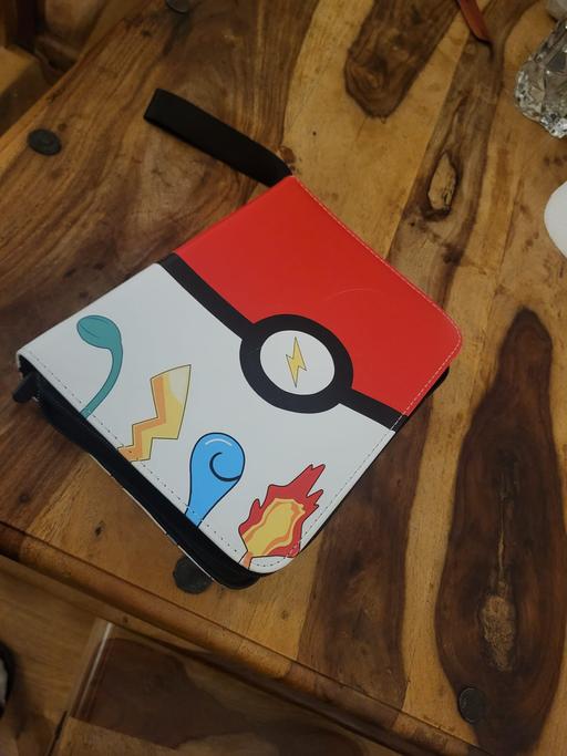  — 128 POKEMON CARDS IN BINDER