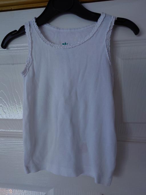 — Girls white vest top size 12-18 months