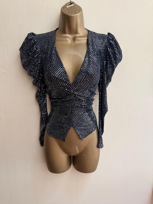  — Black sequin long sleeve V-neck evening top