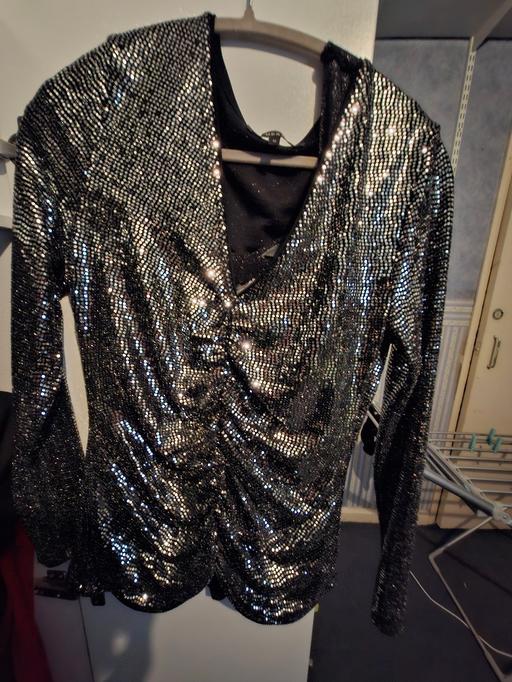  — silver sparkly top suze 12
