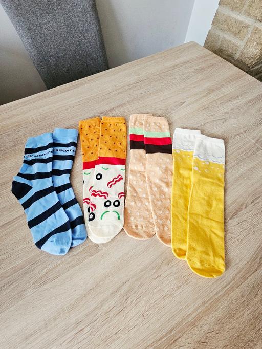  — 4 pairs of patterned socks..NEW