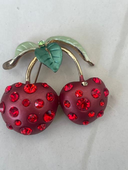  — Lovely cherry brooch 1 stone missing