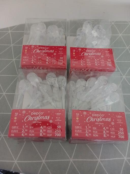  — 4 never used Xmas lights in boxes