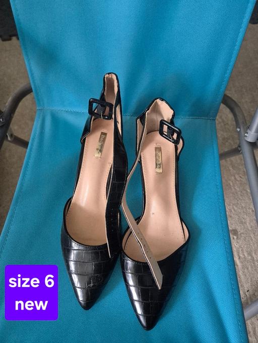 — size 6 snake feel black heels