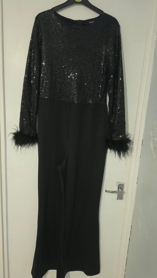  — black seqined jumpsuit.