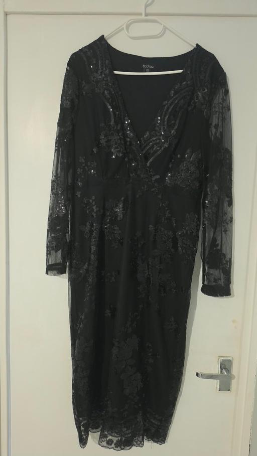  — black sequined dress