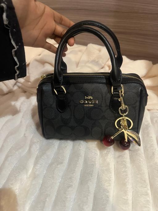  — Black hand bag