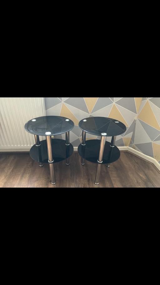 — Pair of round black side tables