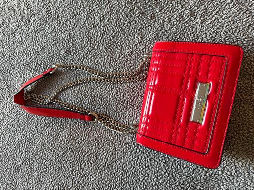  — Red hand bag