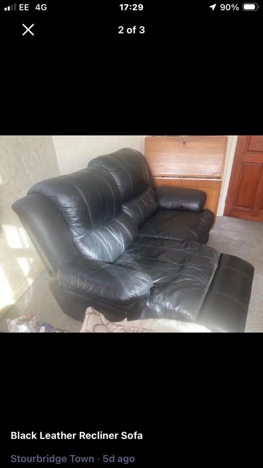  — Black leather Sofa .