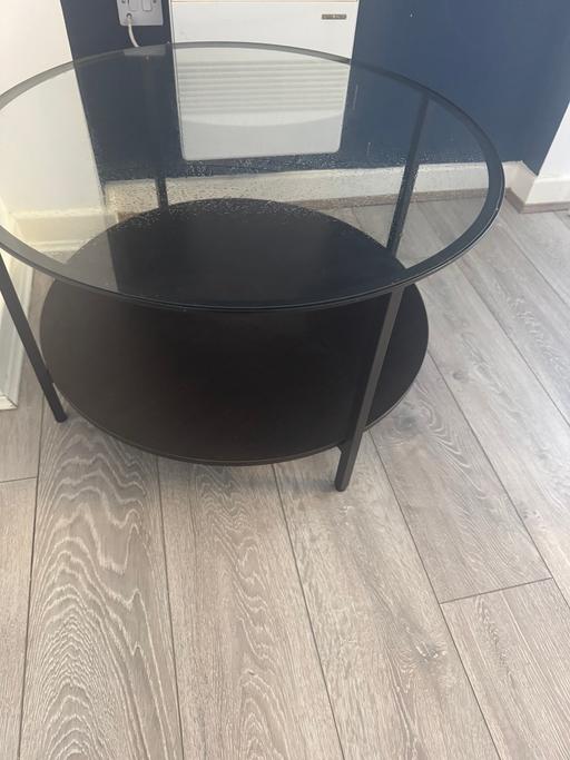  — Black round coffee table