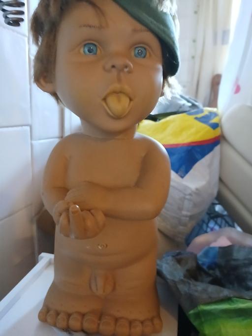  — noveley toilet orniment doll