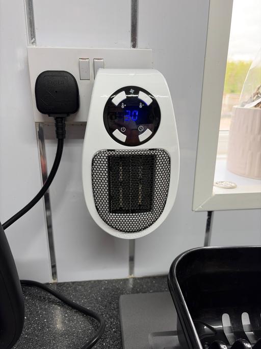  — Portable plug in heater