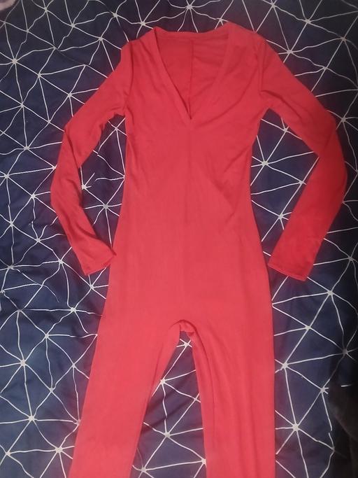  — red jumpsuit