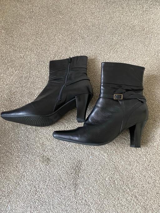  — Black leather boots