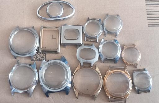  — Collection of watch case fronts with glass