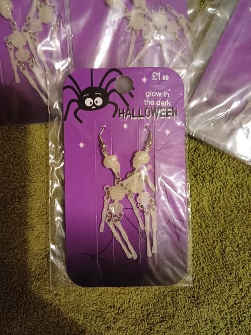  — Glow in the dark skeleton earrings. New