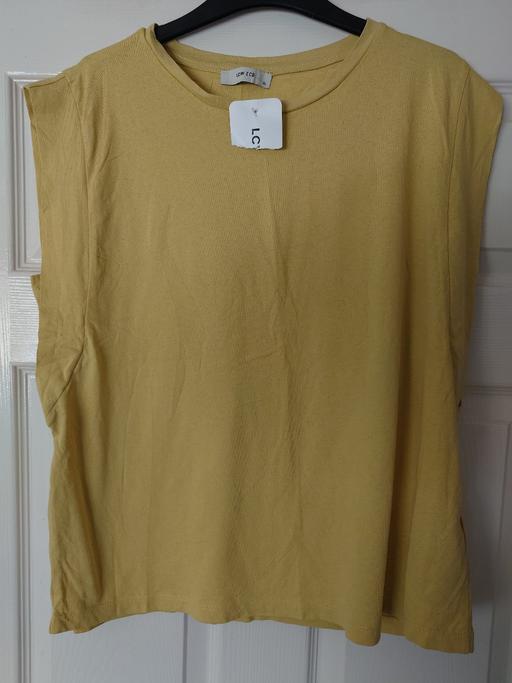  — Women's sleeveless yellow top size XL