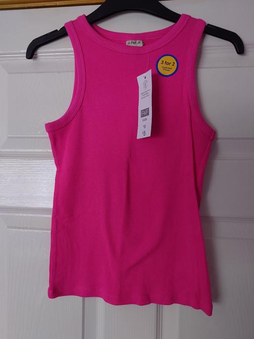  — Girls pink vest top size 11-12 years