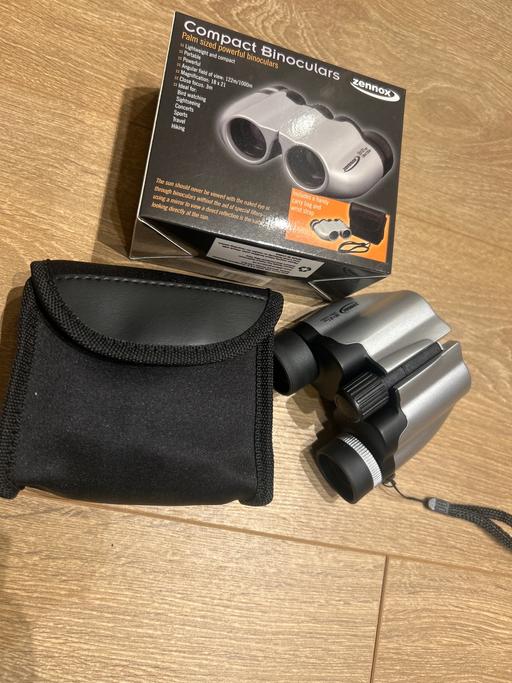  — Binoculars. New in case. Compact. Zennox.