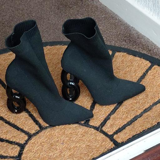  — 4.5" heeled black sock boots