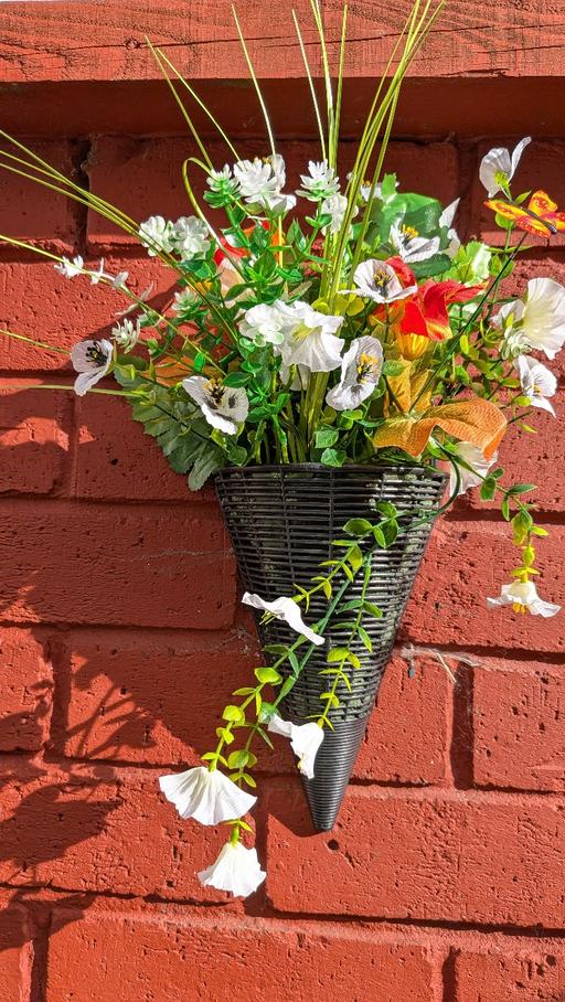  — artificial flowers