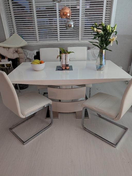  — white high gloss dining table with four chair