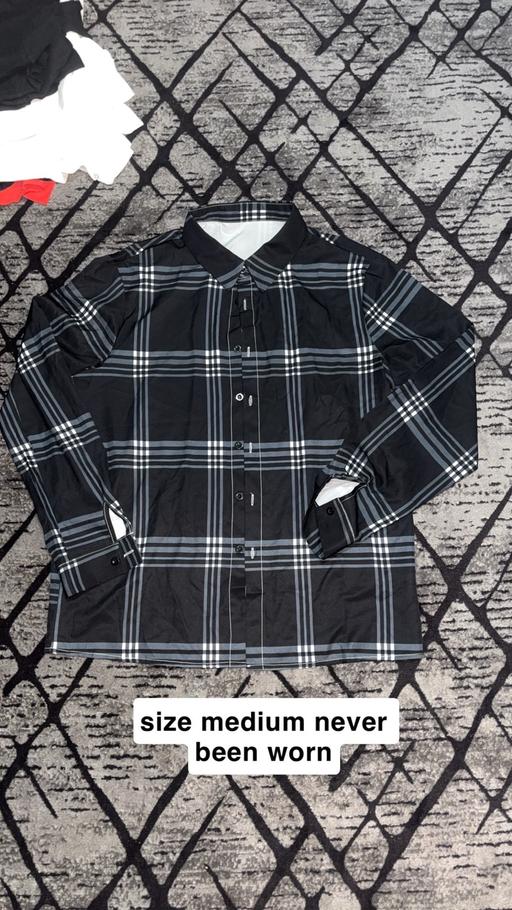  — Size medium men’s shirt