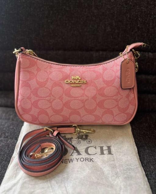  — Coach pink bag