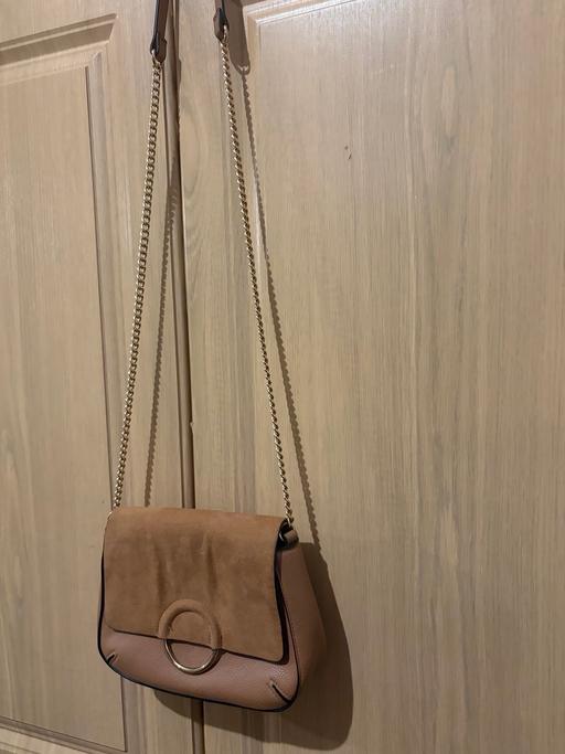  — brown suede bag